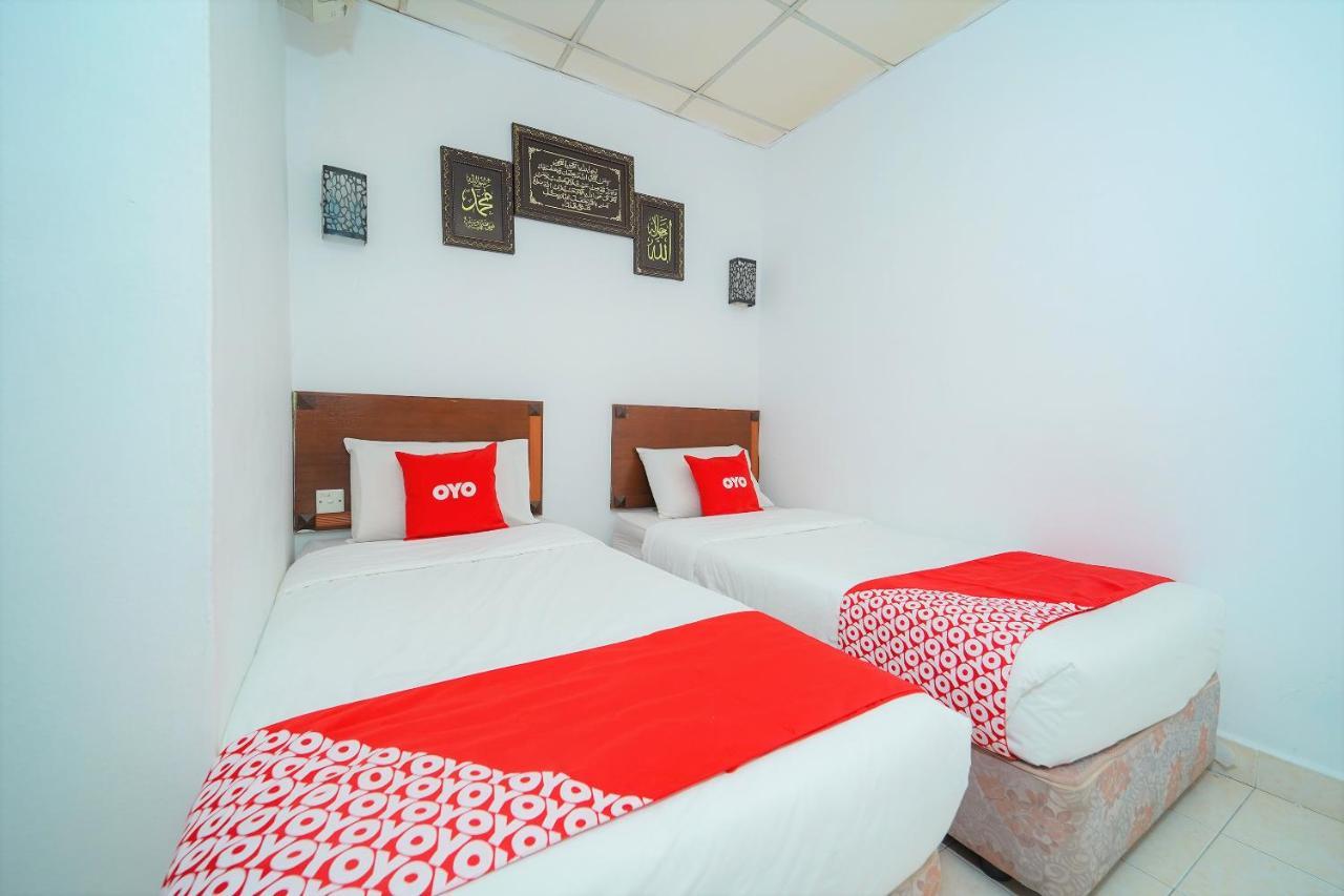 Oyo 89850 Mutiara Motel Kuah Extérieur photo