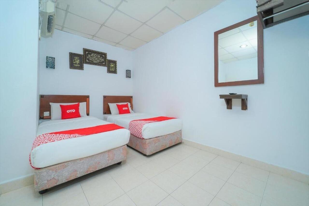 Oyo 89850 Mutiara Motel Kuah Extérieur photo